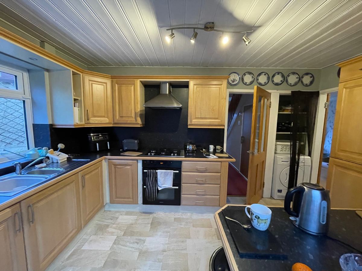 Mossley kitchen before: honey oak units