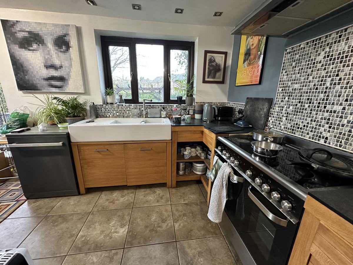 Delph kitchen before: oak units and patterned tiles