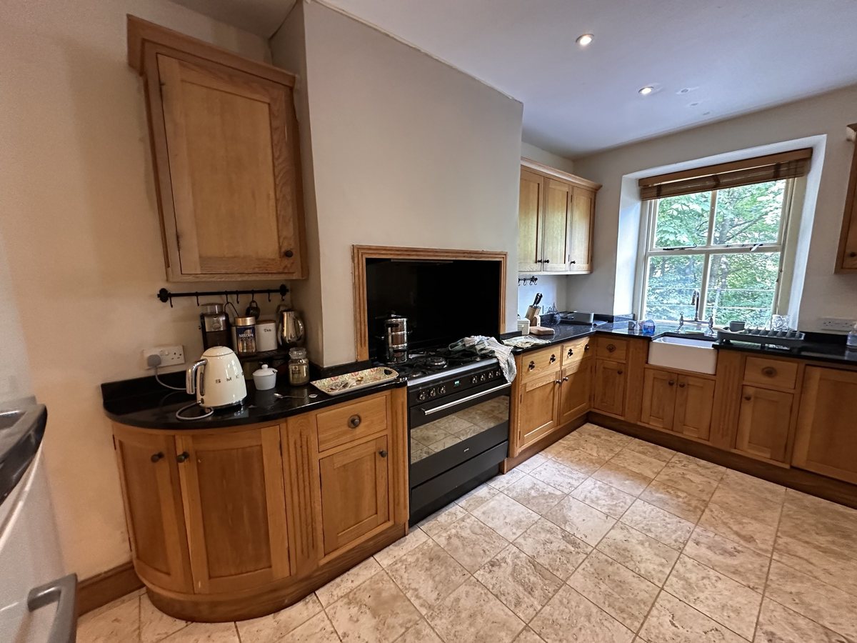 Kitchen before: solid oak units and range cooker