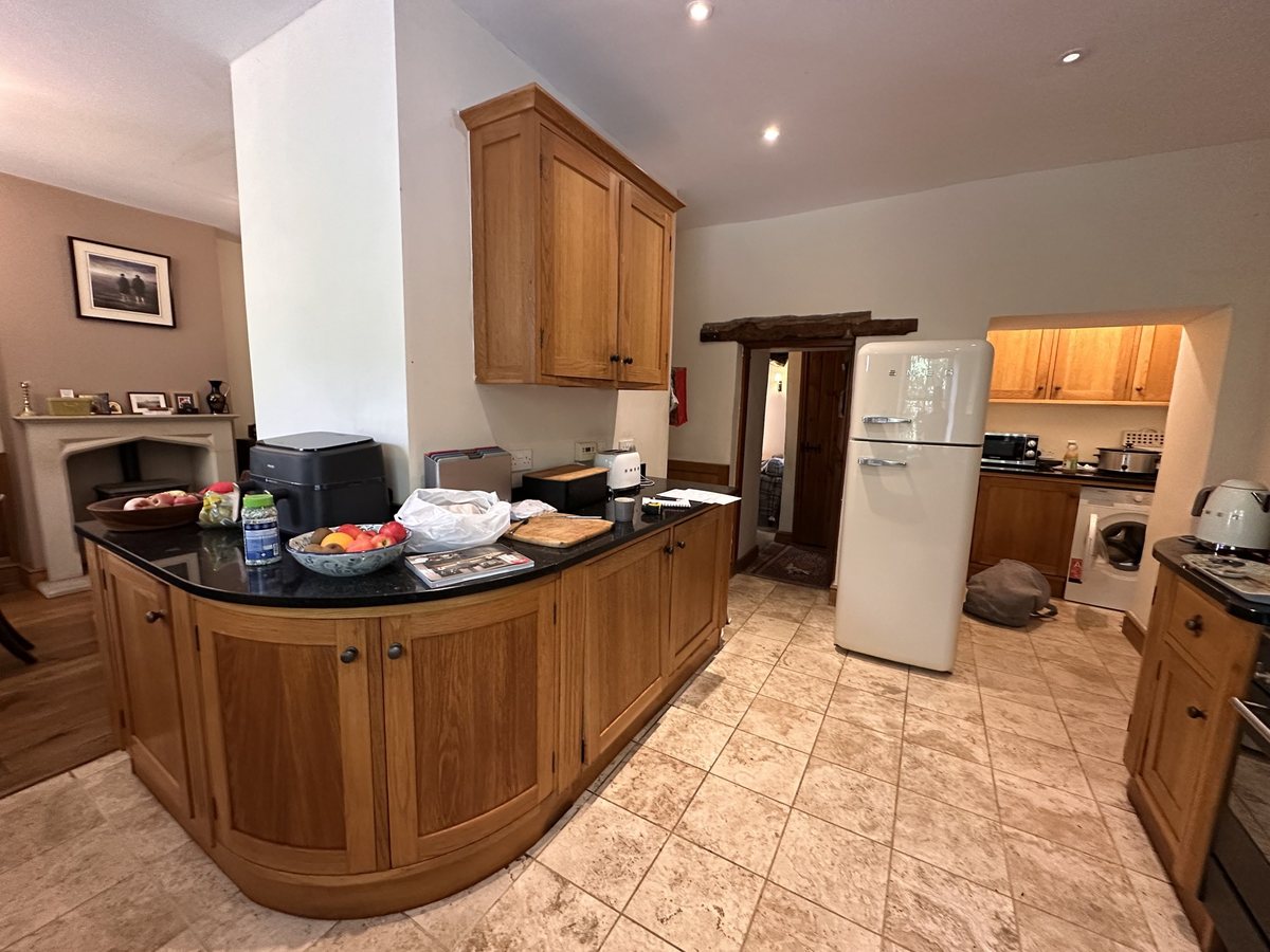 Peninsula before: curved solid oak units