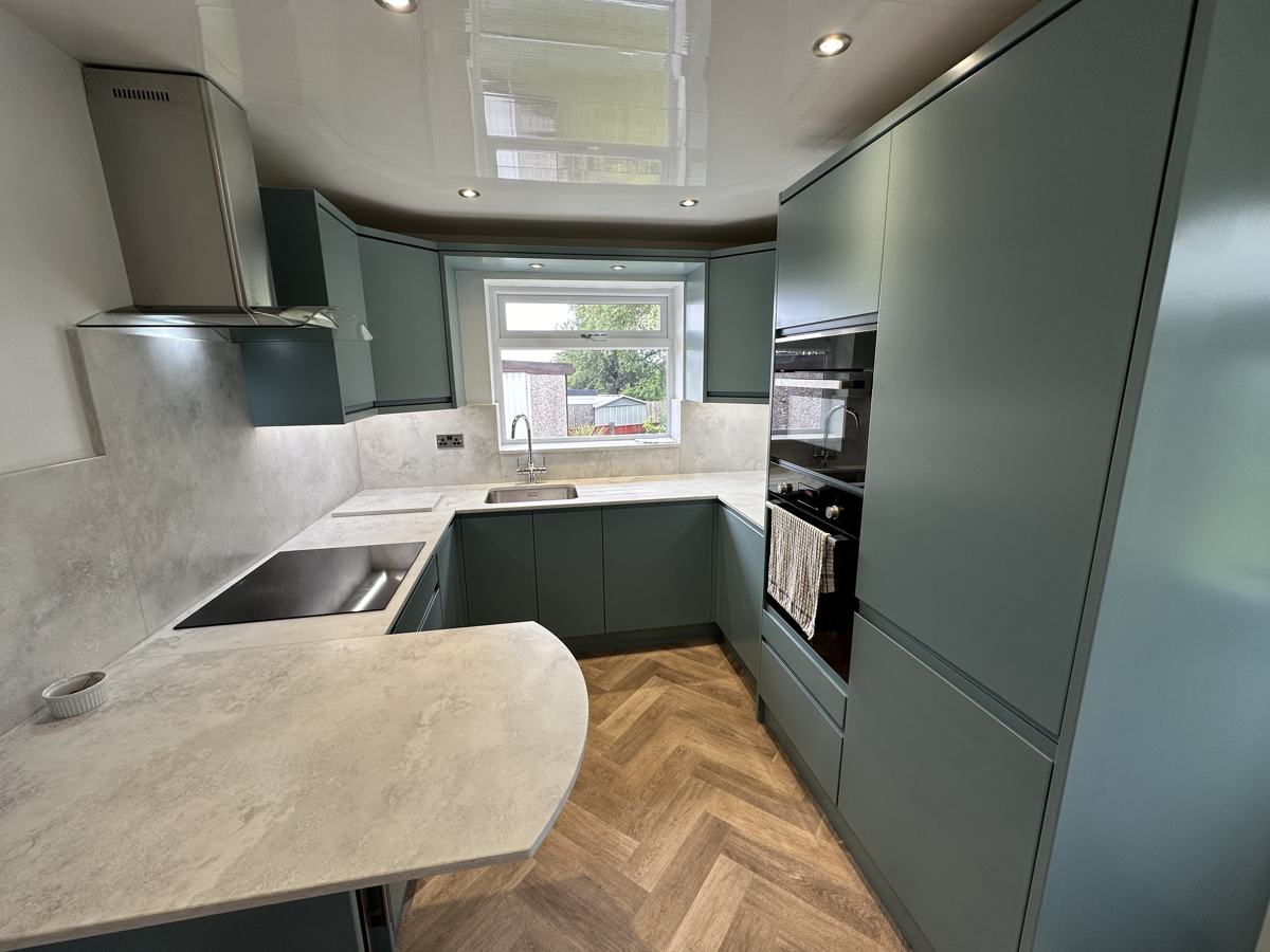 Derker kitchen after: teal handleless units