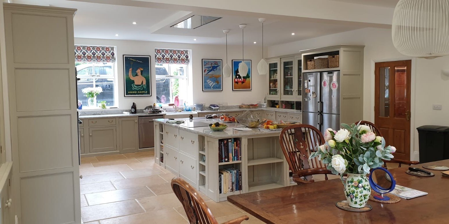 Rebecca Scott's finished kitchen: hand-made units in French Grey, a large island and a dining table