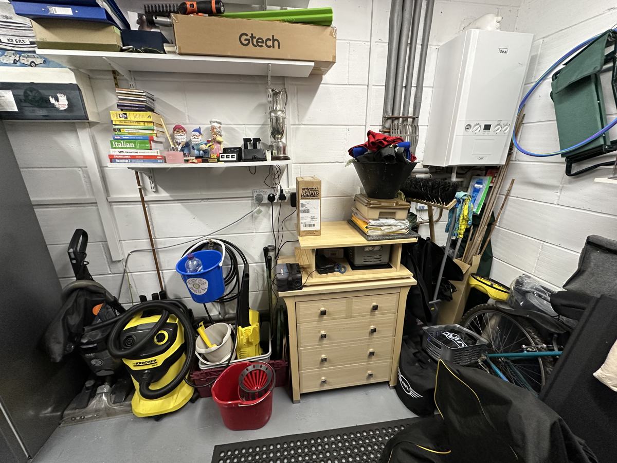 Garage before: cluttered storage