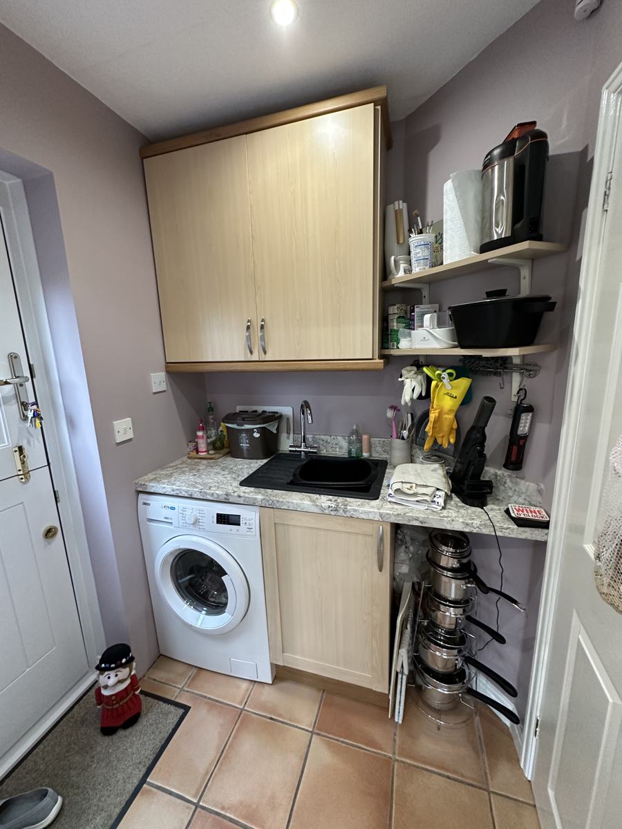 Utility area before: sink, washing machine and wall units