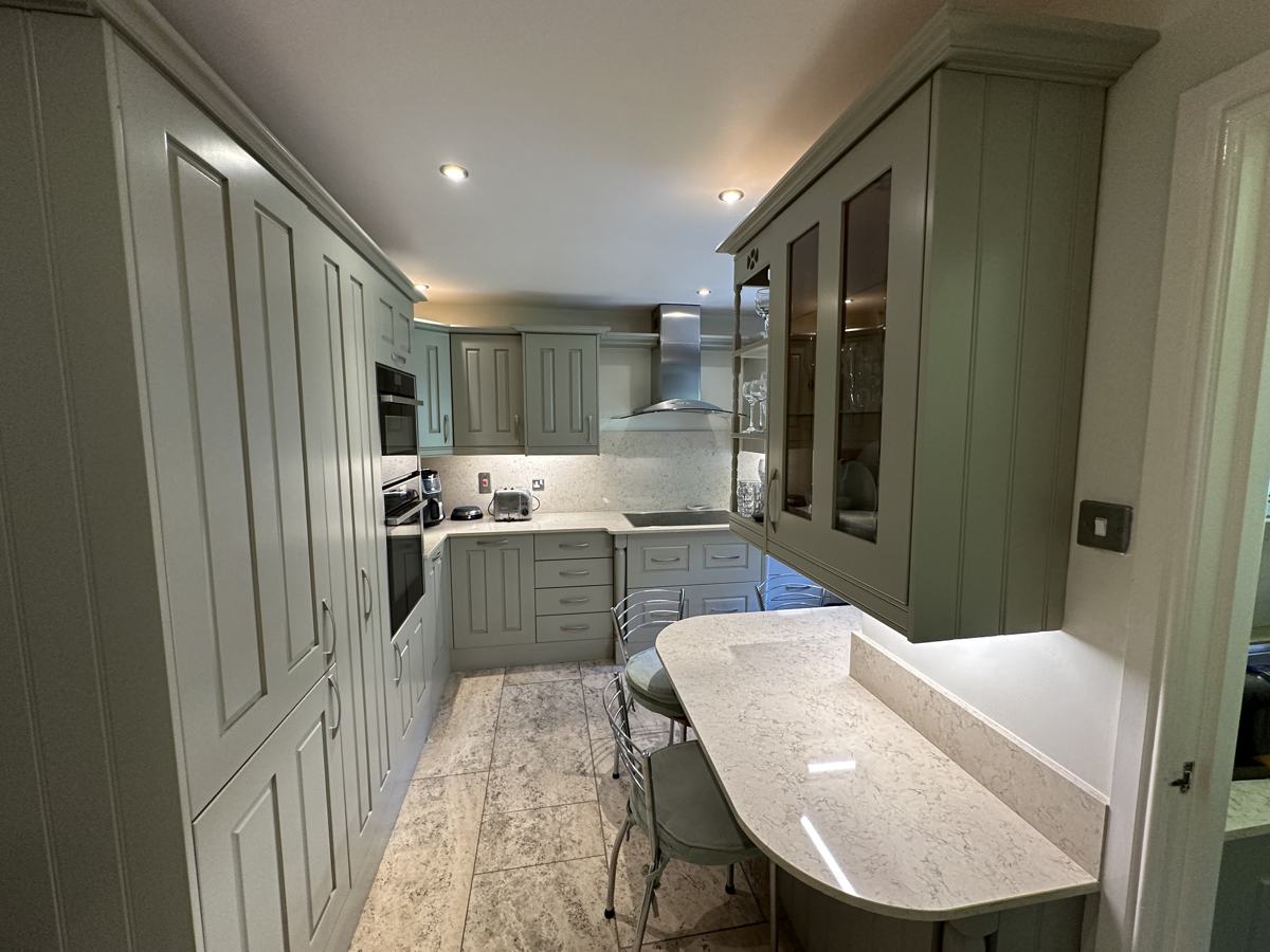 Grasscroft kitchen after: sage green units